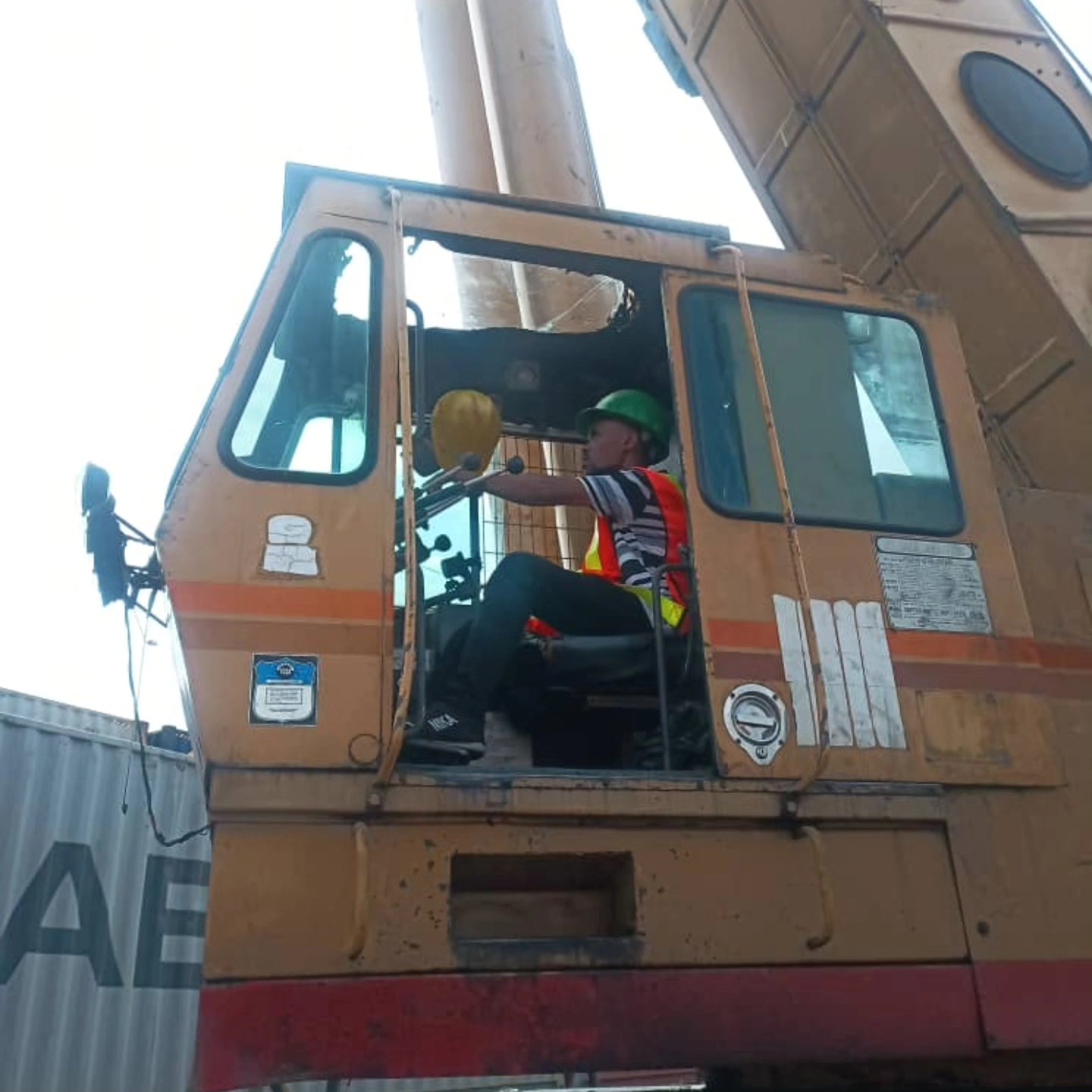 Certified crane operator wearing full PPE